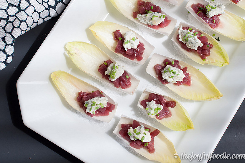 Spiced pears with tangy, herbed goat cheese served over crisp endive - an easy and impressive appetizer or hors d'oeuvre.