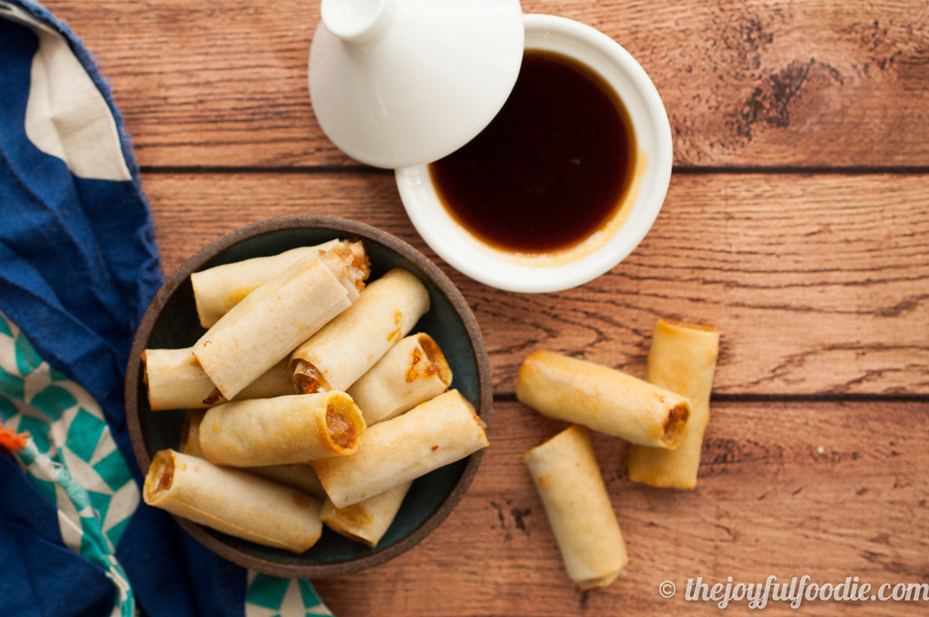 Easy Filipino lumpia shanghai - baked, not fried, and served alongside a spicy passion fruit sweet and sour dipping sauce.